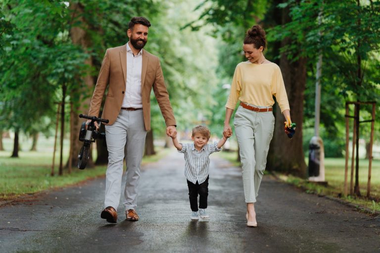 young-family-with-little-son-on-walk-after-work-2024-10-18-09-39-09-utc